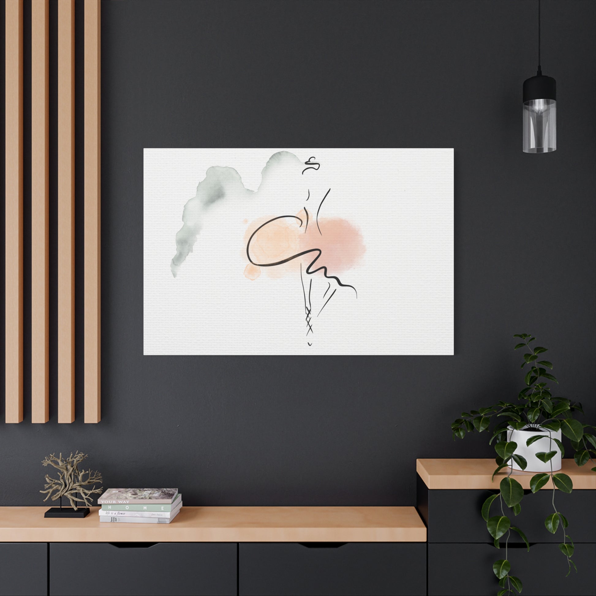 Abstract art print on a dark wall with a wooden shelf and plant below.