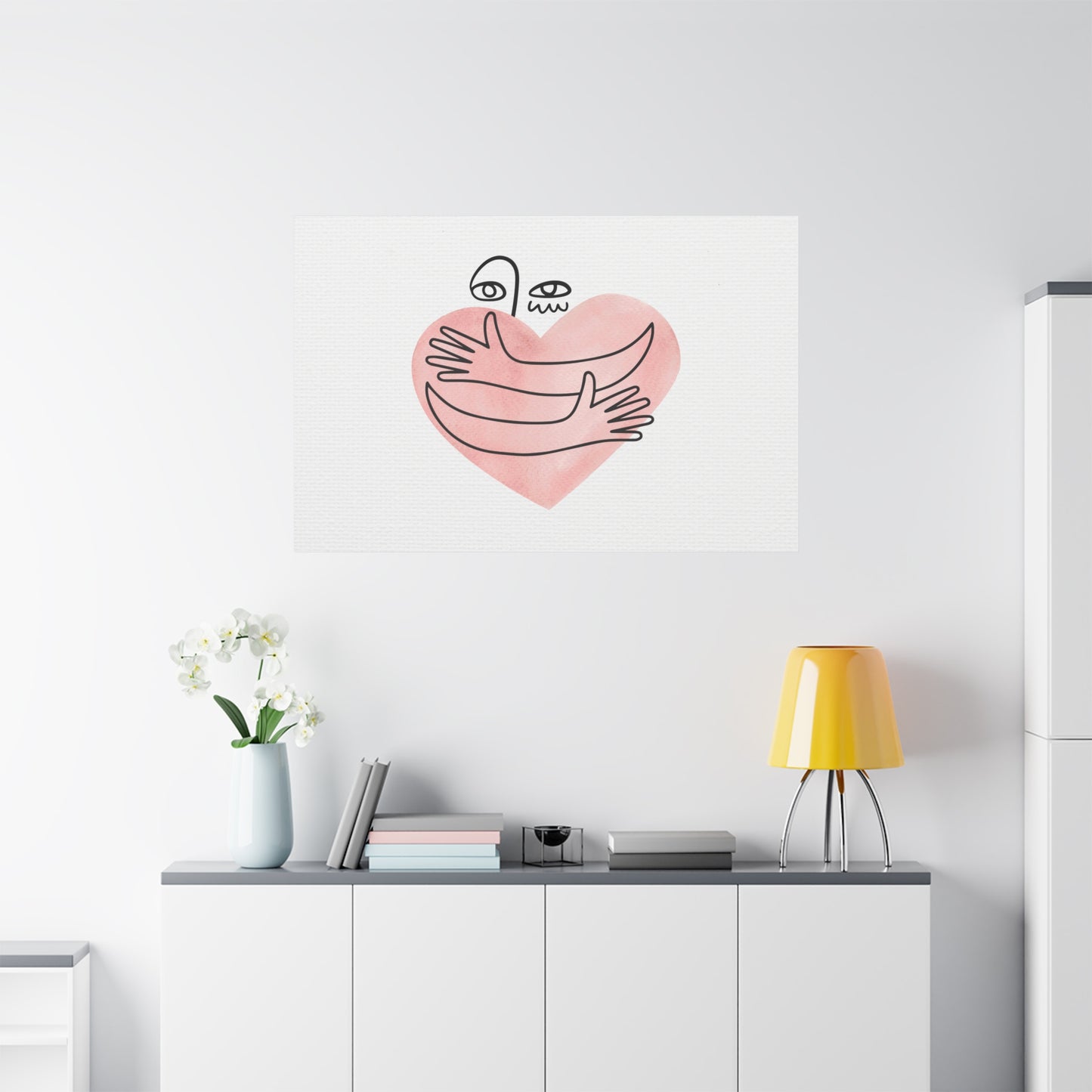 Wall art with a heart design on a white wall above a shelf with decor items.