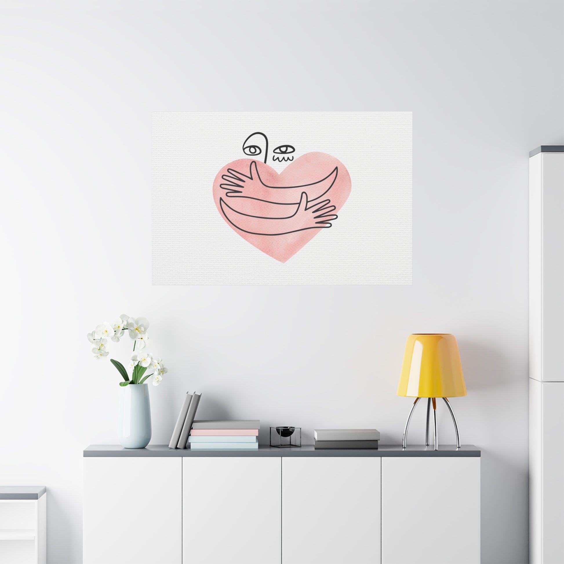 Wall art with a heart design on a white wall above a shelf with decor items.